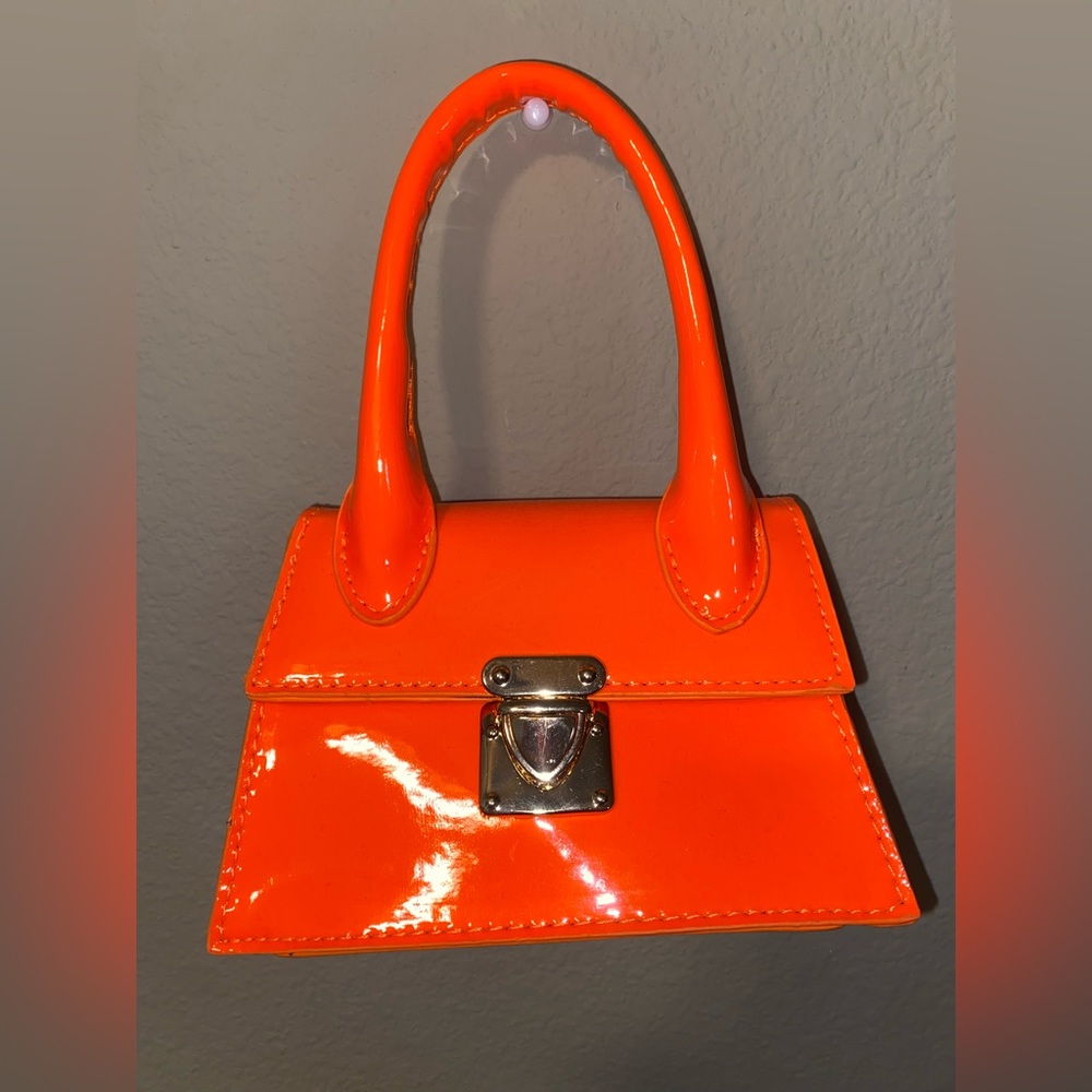 Small bright orange purse
